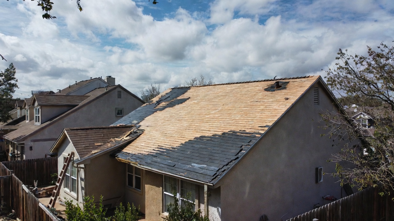 Texas house with severe storm damage to asphalt shingle roof after hail or wind 2026