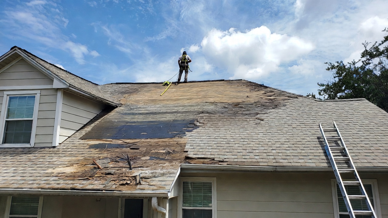 Texas roofing contractor standing on roof during major shingle replacement and repair project 2026