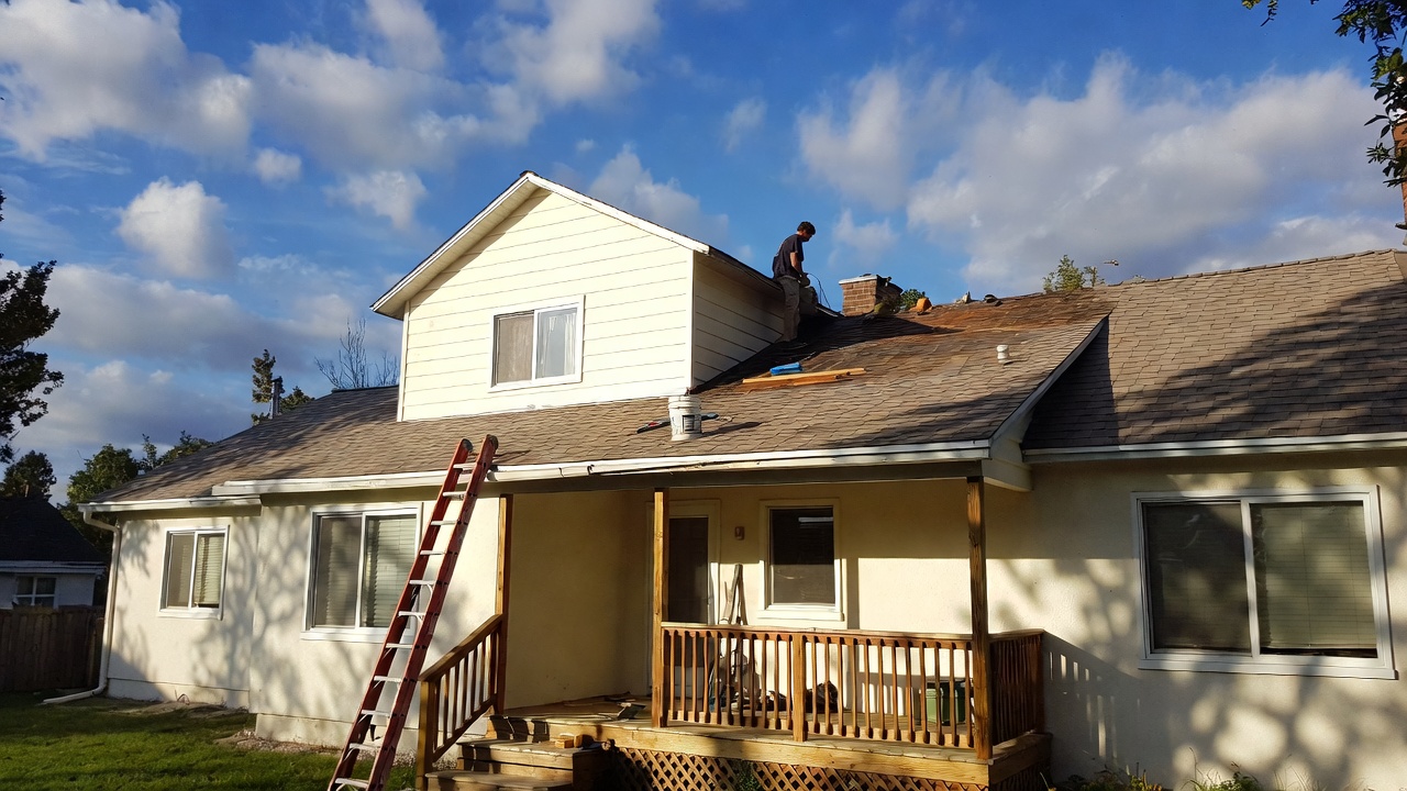 Homeowner performing cheap DIY home repair to save money in 2026