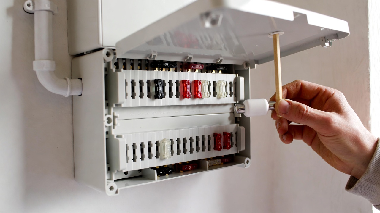 fuse box replacement cost electrician installing panel 2026
